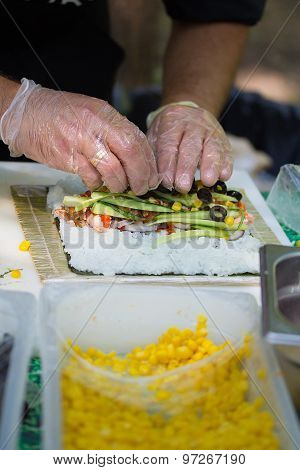 Chef Otdoors Is Prepairing Sushi Rolls, Fresh Ingredients.