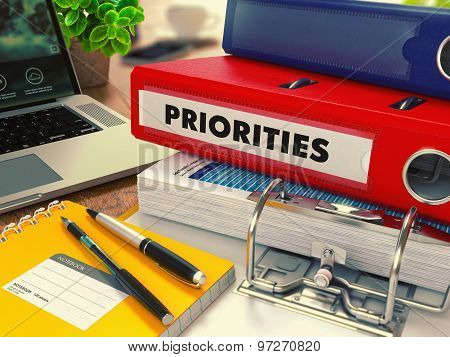 Red Office Folder with Inscription Priorities.