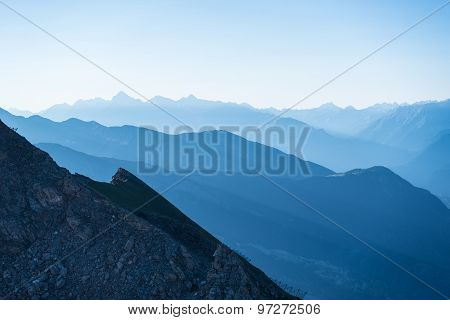 Blue Toned Mountain Silhouette At Sunrise