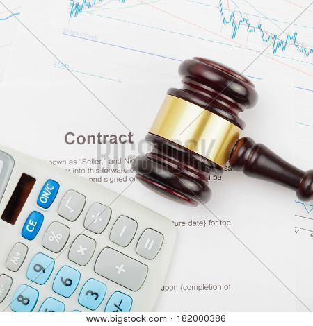 Wooden Judge's Gavel And Calculator Over Some Documents - Close Up Studio Shot