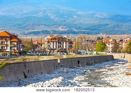 Bansko, Bulgaria April 14, 2017: Spring view with river Glazne, mountains landscape and houses