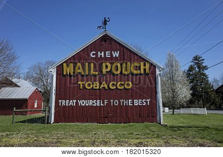 BRICKERVILLE, PA, USA-APRIL 9, 2017:  A Mail Pouch Tobacco barn.  It is a barn with one or more sides painted with an advertisement for the West Virginia Mail Pouch chewing tobacco company.