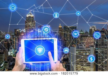 Network of connect digital tablet with wireless communication network business district with office building abstract image visual internet of things concept.