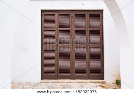 Wooden front door of a home. Front view of a wooden front door.