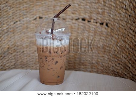 Iced Mocha coffee in takeaway cup at coffee shop.