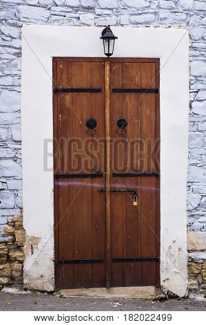 Wooden front door of a home. Front view of a wooden front door.
