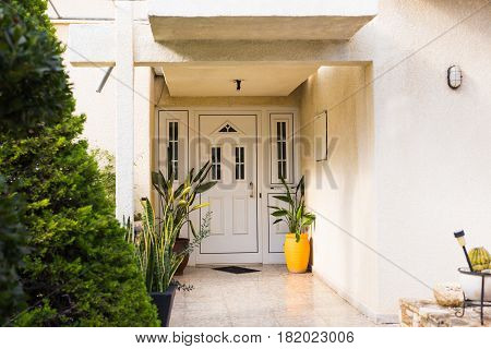 Wooden front door of a home. Front view of a wooden front door.