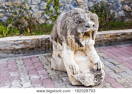 Stone lion statue is situated in front of hotel