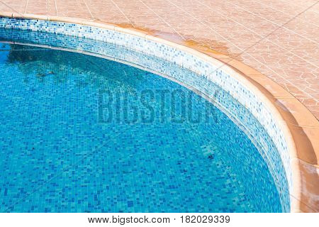 old swimming pool in hotel with blue water