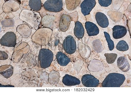Background wall made of stone. Fragment of a wall from a chipped stone