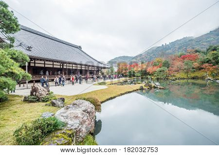 ArashiyamaKyotoJapan-November 26 2015 : Unidentified tourist crowd in front of Tenryuji Sogenchi Pond Garden a UNESCO World Heritage ( Arashiyama) in high season ( Momiji) Kyoto Japan.