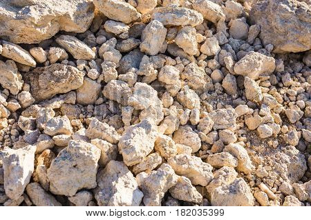 Background wall made of stone. Fragment of a wall from a chipped stone