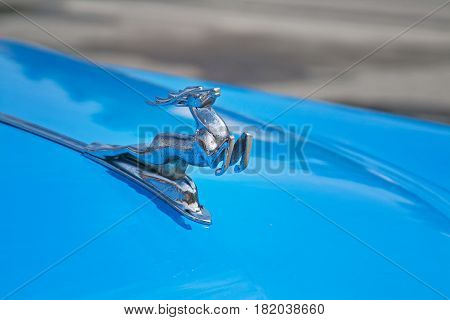Volgograd Russia - May 09 2010: Running deer emblem on the hood of Soviet car Volga GAZ-21