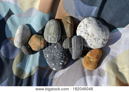 Multi - colored stones of multi-colored fabric