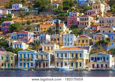 Greece. Dodecanesse. Island Symi Simi . Colorful houses on the rocks