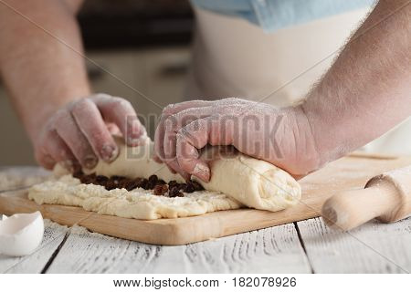 Male Rolling Cotage Cheese Strudel With Raisin