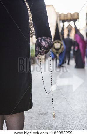 Woman dressed in mantilla during a procession of holy week Spain