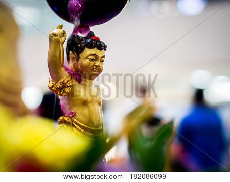 Siddhartha Gautama Buddha Sculpture Flushed by Water and Flower