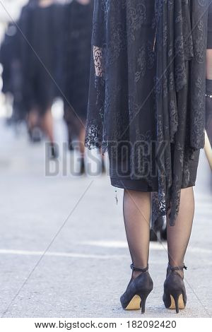 Woman dressed in mantilla during a procession of holy week Spain