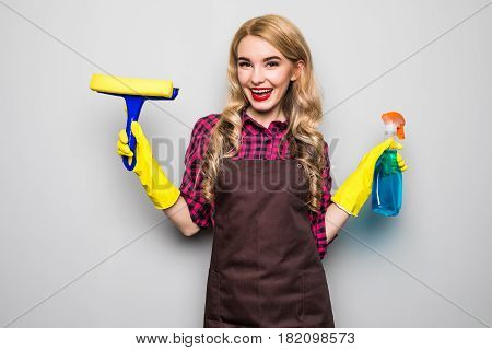 Smiling Woman Holding Bottle Of Chemistry For Cleaning House.