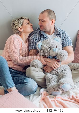 Happy husband and wife in his living room