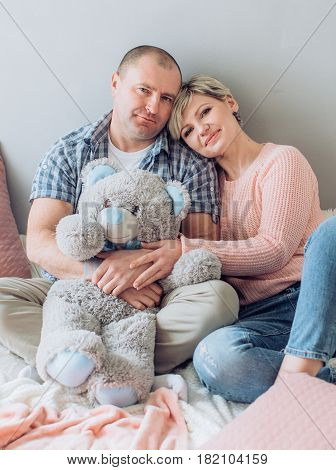 Happy husband and wife in his living room