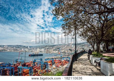 Valparaiso Chile - October 20 2015: Houses of historical shell and Cranes in a port of Valparaiso on October 20 2015 in Valparaiso Chile
