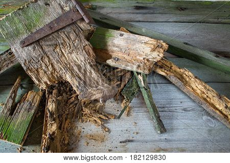 Old heap of old broken wood boards with old nails. Texture background. Pile of wood
