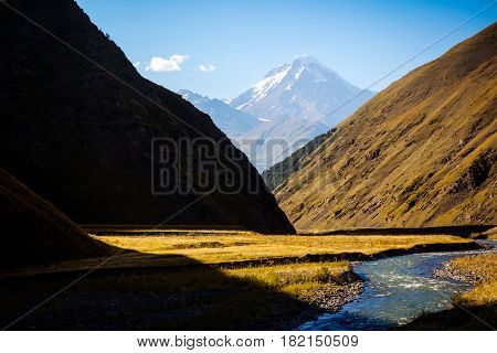 Breathtaking scene of the main Caucasus ridge. Location place Location place Sno village - foot of Mt. Kazbegi, Georgia country, Europe. Wonderful image of wallpaper. Explore the world's beauty. 