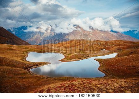 A look at the main Caucasus ridge and Koruldi lake. Picturesque day and gorgeous scene. Location Mestia, Upper Svaneti, Georgia country, Europe. Unique place on earth. Explore the world's beauty.