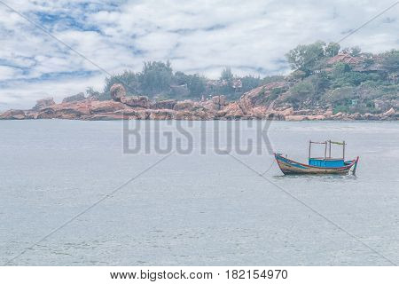 Fishing boat heading out to the sea in the early morning