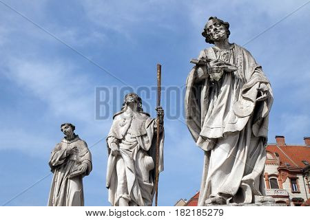 MARIBOR, SLOVENIA - APRIL 03: Saints Anthony of Padua, Roch and Francis Xavier statue, Plague column at Main Square of the city of Maribor in Slovenia. Historical religious sculpture, April 03, 2016.