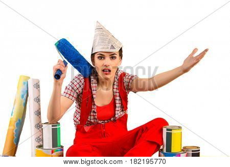 Repair home woman holding paint roller for wallpaper. Aggressive screaming girl in newspaper cap renovation apartment. Paint bank and roll paper background on isolated.