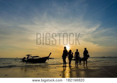 Ao Nang Krabi Thailand - March 02 2017: People on the Ao Nang beach at sunset in Krabi province Thailand