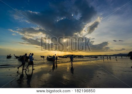 Ao Nang Krabi Thailand - March 02 2017: People on the Ao Nang beach at sunset in Krabi province Thailand