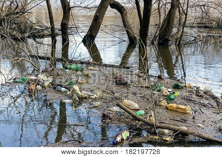 The river Klyazma which has spilled on spring collects tons of garbage from coast