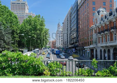 Spain. Sunny day, Madrid and cars and bus