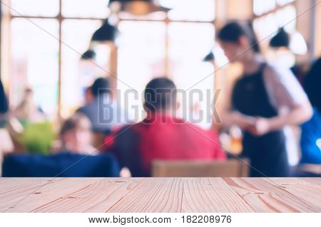 blur image of restaurant or coffee shop with bokeh for background usage. vintage tone