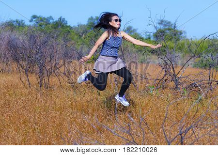 Lady erlax enjoy outdoor in field dry grass at Mukdahan Nation Park Thailand