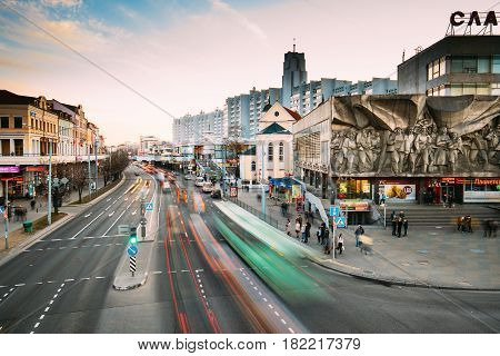 Minsk, Belarus - April 3, 2017: Cathedral of Saints Peter and Paul - temple of Belarusian Exarchate of Russian Orthodox Church and Bas-relief of the Soviet era on old facade building on Nemiga Street