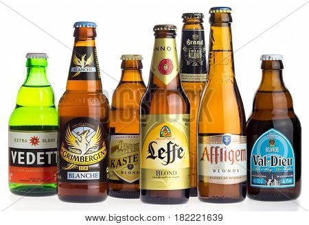 GRONINGEN, NETHERLANDS - APRIL 16, 2017: Collection of Grimbergen, Vedett, KAsteel, Leffe, Affligem, Val-Dieu blond beers isolated on a white background