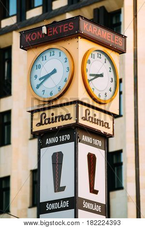 Riga, Latvia - July 2, 2016: Laima Clock was erected by the Social Democrats in 1924 to help workers to get to work on time. Now it is one of landmarks and an advert for the Laima chocolate company