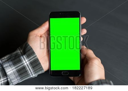 Business man using smart phone with green screen for internet and email. Sequence Concepts of using mobile technologies and smarfon in mobile applications in daily communication