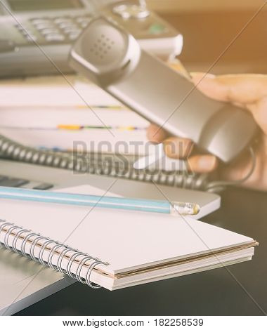 travel agency staff is taking call for flight booking