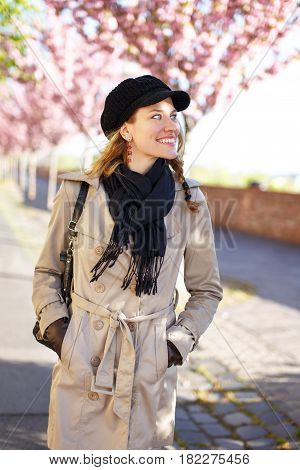 Young life balanced woman waliking in park at spring looks away