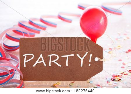One Label With English Text Party. Party Decoration Like Streamer, Confetti And Balloon. Wooden Background With Vintage, Retro Or Rustic Syle