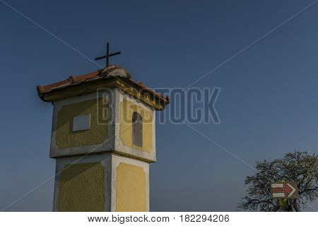 Yellow chapel near Strachotin village in spring sunny evening