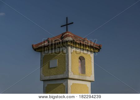 Yellow chapel near Strachotin village in spring sunny evening