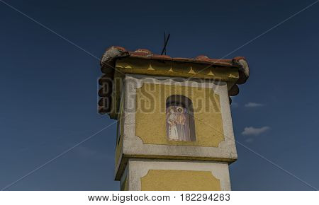 Yellow chapel near Strachotin village in spring sunny evening