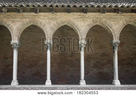 Columns and arches of cloister in Dominican monastery Couvent des Jacobins in Toulouse, France.